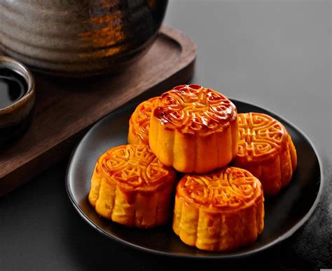 Bake the mooncakes until the tops are no longer shiny and the dough has just set, 10 to 12 minutes. Let cool 10 minutes. Whisk the egg together with a splash of water in a small bowl, then brush ...